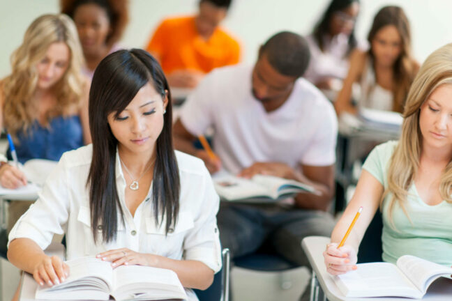 Adult students study in a classroom