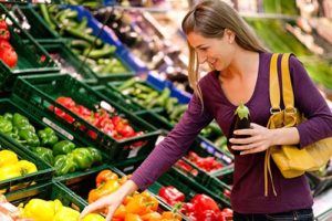 Woman shops for produce at a grocery store