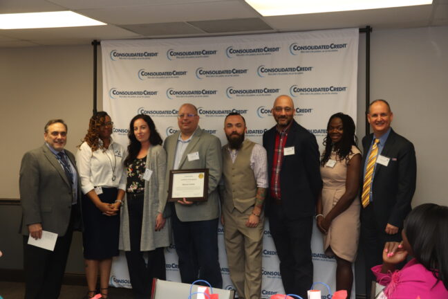 Consolidated Credit accepts a certificate of recognition from the United Way of Broward County Mission United team at our 8th annual financial literacy breakfast