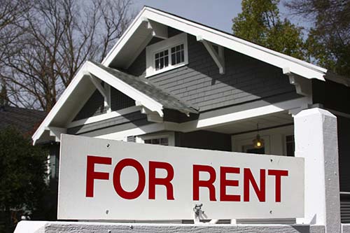 For rent sign in front of a house