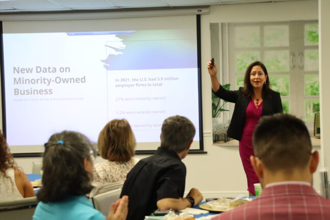 Woman presenting a slide during a workshop or training session