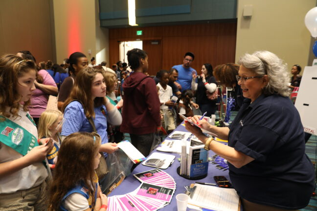Crowd of attendees at a busy conference or expo hall